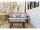 A comfortable outdoor patio with a cushioned sofa and coffee table offers a peaceful view of nature at 2011 Trident Maple Ln, Chapel Hill, NC 27517