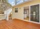 Inviting back deck with sliding glass door leading to the kitchen, ideal for outdoor dining and relaxation at 204 Sugarland Dr, Apex, NC 27502
