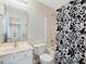 Bathroom featuring a floral shower curtain, vanity, and toilet, offering a private space at 204 Sugarland Dr, Apex, NC 27502