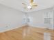 Bright bedroom with hardwood floors, neutral walls, and a ceiling fan for comfort at 204 Sugarland Dr, Apex, NC 27502