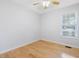 Bedroom features hardwood floors, neutral walls, and window, creating a serene space at 204 Sugarland Dr, Apex, NC 27502