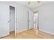 Bedroom with closet, fan, and view to other rooms, creating a functional living space at 204 Sugarland Dr, Apex, NC 27502