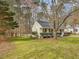 Charming single-story home with a well-manicured lawn and cozy front porch, offering curb appeal and warmth at 204 Sugarland Dr, Apex, NC 27502