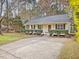 Charming single-story home with a welcoming front porch and a well-maintained landscaped yard at 204 Sugarland Dr, Apex, NC 27502