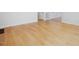 Bright living room featuring hardwood floors, white walls and trim at 204 Sugarland Dr, Apex, NC 27502