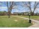 Green space with walking path, trees, and pet waste disposal station at 2418 Pecan Ridge Way, Apex, NC 27502