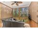 Relaxing screened porch with comfortable seating and view of the surrounding trees at 2418 Pecan Ridge Way, Apex, NC 27502