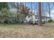 Expansive backyard with mature trees and lush greenery, creating a private retreat at 256 Marilyn Cir, Cary, NC 27513