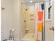 Bathroom featuring a tiled walk-in shower with a glass door, neutral tones and recessed lighting at 256 Marilyn Cir, Cary, NC 27513