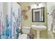 Cozy bathroom with a charming cactus shower curtain and decorative woven wall baskets at 256 Marilyn Cir, Cary, NC 27513