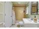 Bathroom featuring a tile shower, white vanity with decorative sink, and bright lighting at 256 Marilyn Cir, Cary, NC 27513