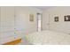 Bedroom featuring hardwood floors, closet space, and patterned bedding at 256 Marilyn Cir, Cary, NC 27513