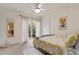 Bright bedroom with sliding door to backyard; features closet space and ceiling fan at 256 Marilyn Cir, Cary, NC 27513