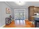View of formal dining room, kitchen, and additional dining area at 256 Marilyn Cir, Cary, NC 27513