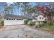 Inviting home featuring a two-car garage and mature trees in a peaceful neighborhood at 256 Marilyn Cir, Cary, NC 27513
