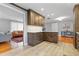 Modern kitchen with dark cabinets, stainless steel appliances, and an open layout at 256 Marilyn Cir, Cary, NC 27513