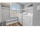 Bright laundry room featuring a washer, dryer, and window providing natural light at 256 Marilyn Cir, Cary, NC 27513