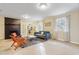 Inviting living room features a brick fireplace, cozy seating, and built-in shelving at 256 Marilyn Cir, Cary, NC 27513