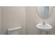 Half bath with a pedestal sink and toilet at 261 Canopy Dr, Graham, NC 27253