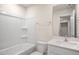 Clean bathroom featuring a shower-tub combo, sleek vanity, and modern fixtures at 261 Canopy Dr, Graham, NC 27253