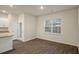 Bright kitchen with island, granite countertops, and large window for natural light at 261 Canopy Dr, Graham, NC 27253