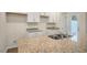 A bright, spacious kitchen with granite countertops and modern finishes at 261 Canopy Dr, Graham, NC 27253