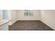 A bright room with large windows near an kitchen island with granite countertop at 261 Canopy Dr, Graham, NC 27253