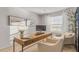Bright office with modern wood desk, neutral carpet, and chairs, creating a serene and functional workspace at 267 Canopy Dr, Graham, NC 27253