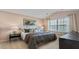 Main bedroom with tray ceiling, large window, and an ensuite bathroom at 267 Canopy Dr, Graham, NC 27253