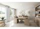 Bright home office featuring large windows, built-in shelving, and a stylish desk at 27 Artesa Ct, Fuquay Varina, NC 27526