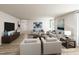 Spacious living room with hardwood floors, sleek furnishings, and abundant natural light at 27 Artesa Ct, Fuquay Varina, NC 27526