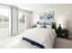 Serene bedroom with large windows and plush carpeting, complete with stylish décor and cozy bedding at 27 Artesa Ct, Fuquay Varina, NC 27526