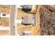 Overhead view of a home displaying a modern roof design, patio, and well-kept landscape at 31 Harrow Ter, Roxboro, NC 27574