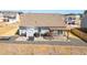 Aerial view of the home's backyard with a wooden pergola, outdoor dining area, and shed at 31 Harrow Ter, Roxboro, NC 27574