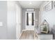 Inviting entryway with luxury vinyl plank flooring, neutral walls, stylish decor, and a welcoming atmosphere at 31 Harrow Ter, Roxboro, NC 27574