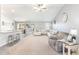 Bright, open-concept living room with a kitchen bar and large windows at 31 Harrow Ter, Roxboro, NC 27574
