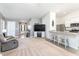 Open-concept living space with plush carpet, neutral walls, modern kitchen, and seamless flow for entertaining at 31 Harrow Ter, Roxboro, NC 27574