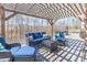 Inviting outdoor patio area with comfortable seating and a charming pergola at 31 Harrow Ter, Roxboro, NC 27574