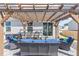 Covered pergola with patio furniture creating a perfect outdoor seating area at 31 Harrow Ter, Roxboro, NC 27574