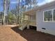 Exterior view of the covered back porch with stairs leading to the backyard at 3273 Argyll Dr, Sanford, NC 27332