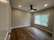 Bedroom featuring recessed lighting, ceiling fan, large window, and hardwood flooring at 3273 Argyll Dr, Sanford, NC 27332