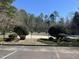 A fenced neighborhood pool with greenery and a covered pavilion is available for community residents to enjoy at 3273 Argyll Dr, Sanford, NC 27332