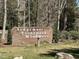 Community entrance sign for Sedgemoor, Trentwood, and Woodmere set amidst trees on a grassy lawn at 3273 Argyll Dr, Sanford, NC 27332