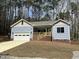 Inviting single-story home with a covered front porch and freshly mulched landscaping at 3273 Argyll Dr, Sanford, NC 27332
