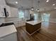 Modern kitchen featuring white cabinets, stainless steel appliances, and a center island at 3273 Argyll Dr, Sanford, NC 27332