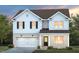 Charming two-story home boasts brick and siding exterior, complemented by a well-manicured lawn and inviting front entrance at 340 Bridle Brook Way, Fuquay Varina, NC 27526
