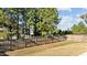 Grassy backyard is enclosed by a wooden fence, providing privacy and a safe space at 3541 Fairstone Rd, Wake Forest, NC 27587