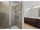 Bathroom featuring a glass enclosed shower and double sink vanity with granite counter tops at 3541 Fairstone Rd, Wake Forest, NC 27587