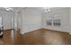 Spacious dining room with hardwood floors, elegant chandelier, and classic wainscoting at 3541 Fairstone Rd, Wake Forest, NC 27587