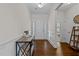 Elegant foyer with hardwood floors, decorative wainscoting, and a stylish console table at 3541 Fairstone Rd, Wake Forest, NC 27587